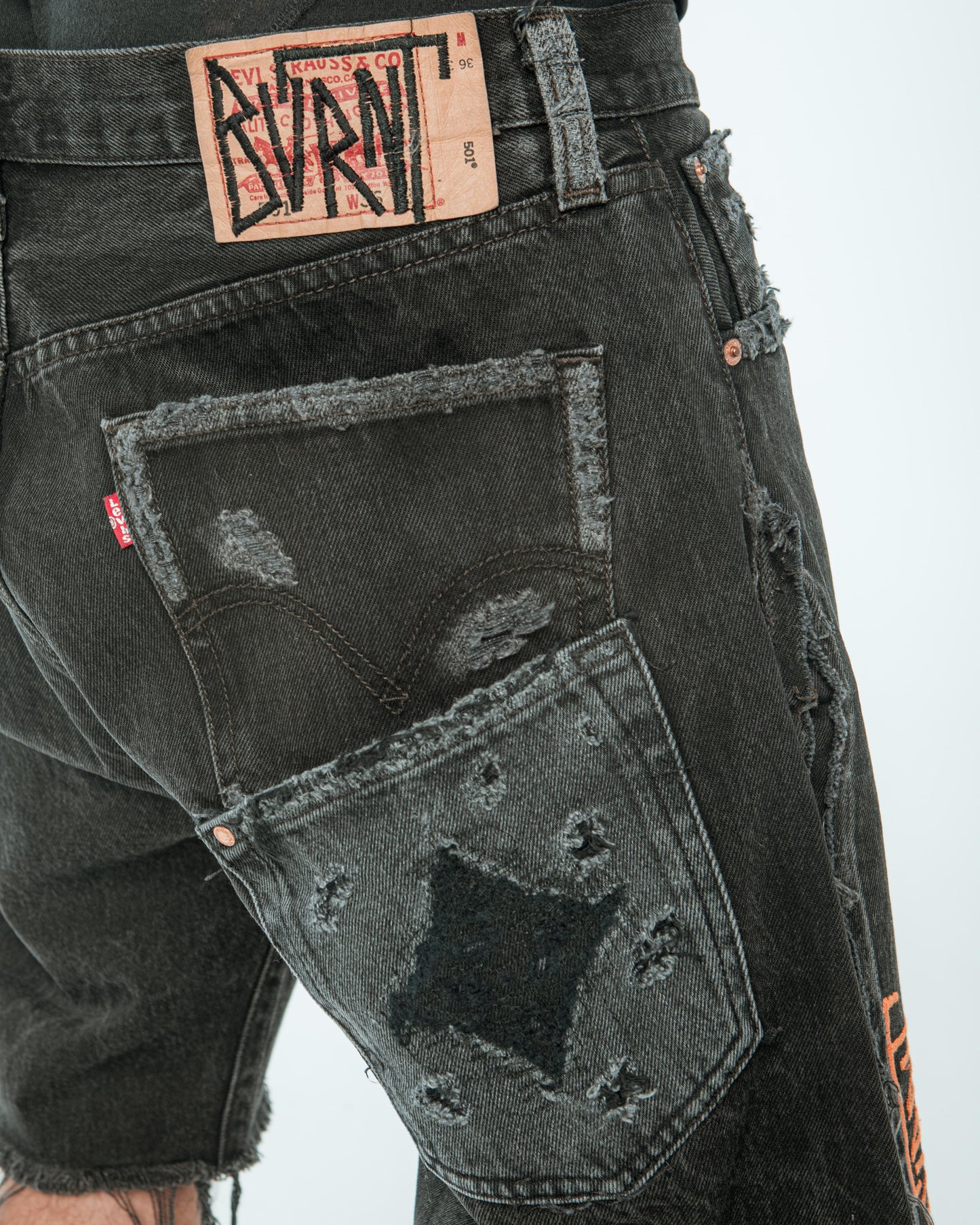“ORANGE IS BLACK” DISTRESSED JORTS